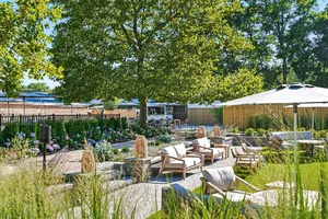 Outdoor Living Room seating among hydrangeas and trees